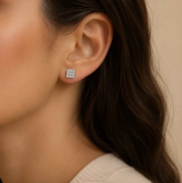 Woman wearing Lustre Grid platinum polished square cluster stud earrings