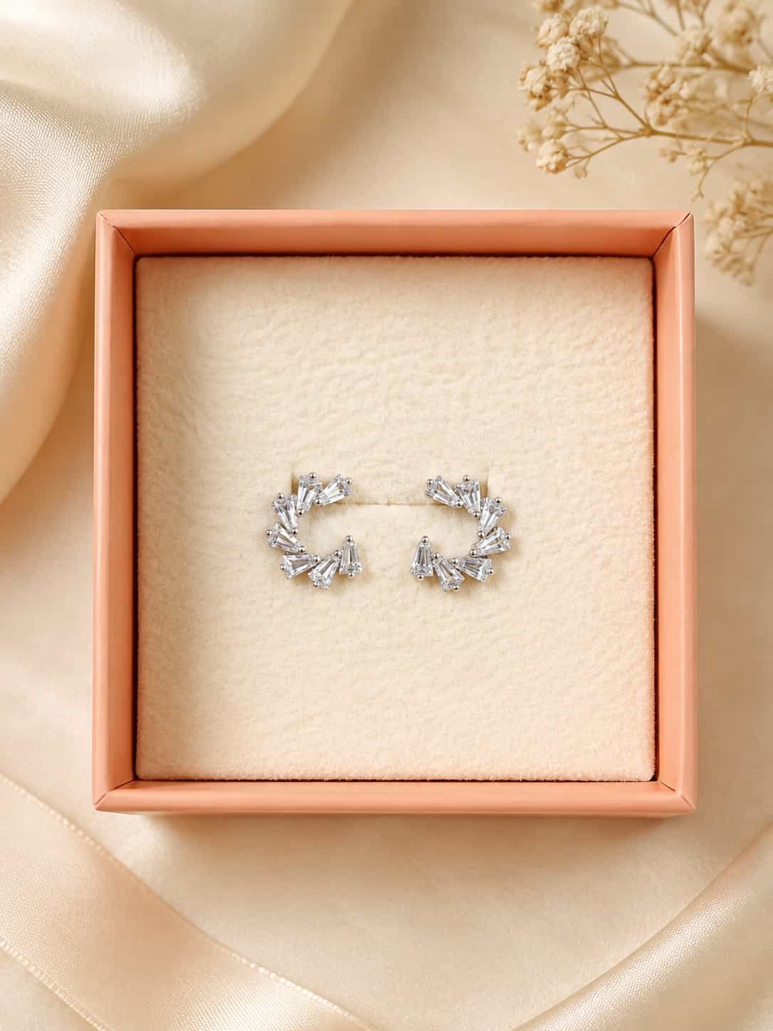 Platinum polished crystal fan open hoop earrings presented in an elegant jewellery gift box