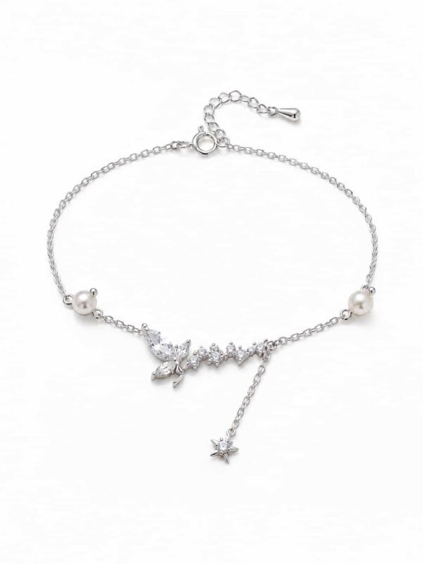 Celestia butterfly and pearl sparkle bracelet with clear stones, star charm and delicate silver-tone chain