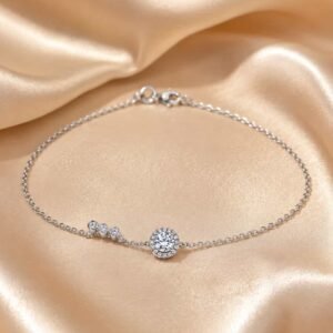 Delicate halo sparkle bracelet for women displayed on champagne satin