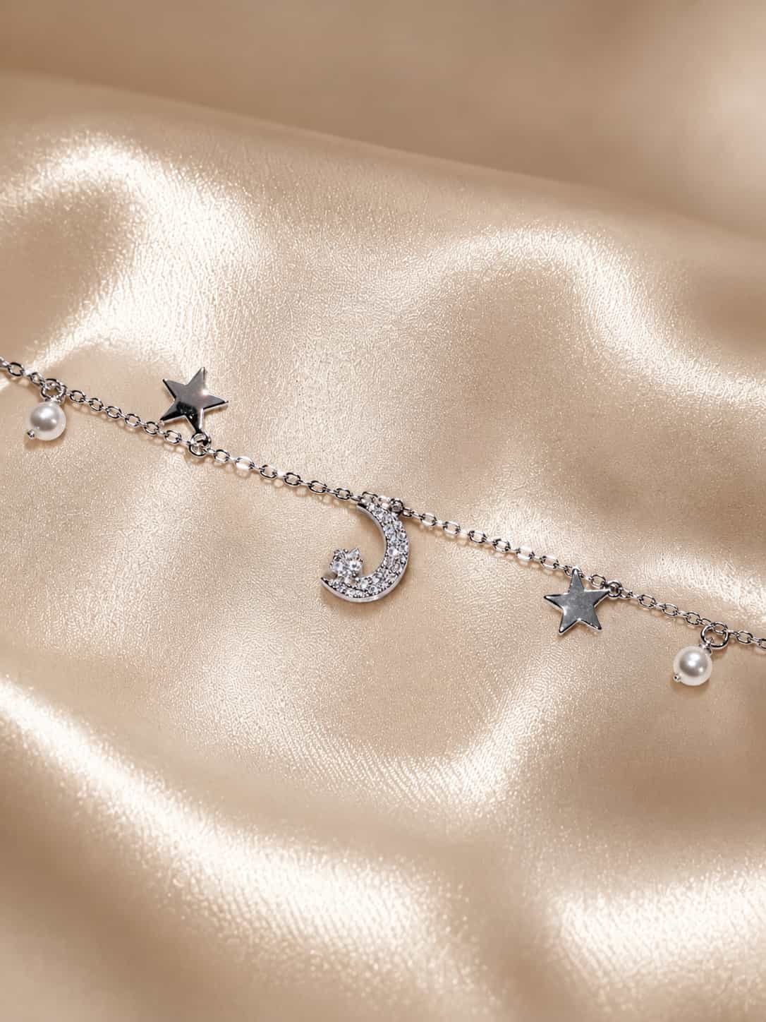 Celestial moon, star and pearl charm bracelet with sparkling crescent moon on champagne satin