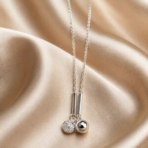 Lumière twin sphere sparkle pendant necklace with crystal-studded and polished silver-tone spheres on champagne satin