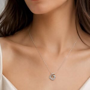 Elan Two-Tone Interlocking Crystal Pendant Necklace – Platinum Polished